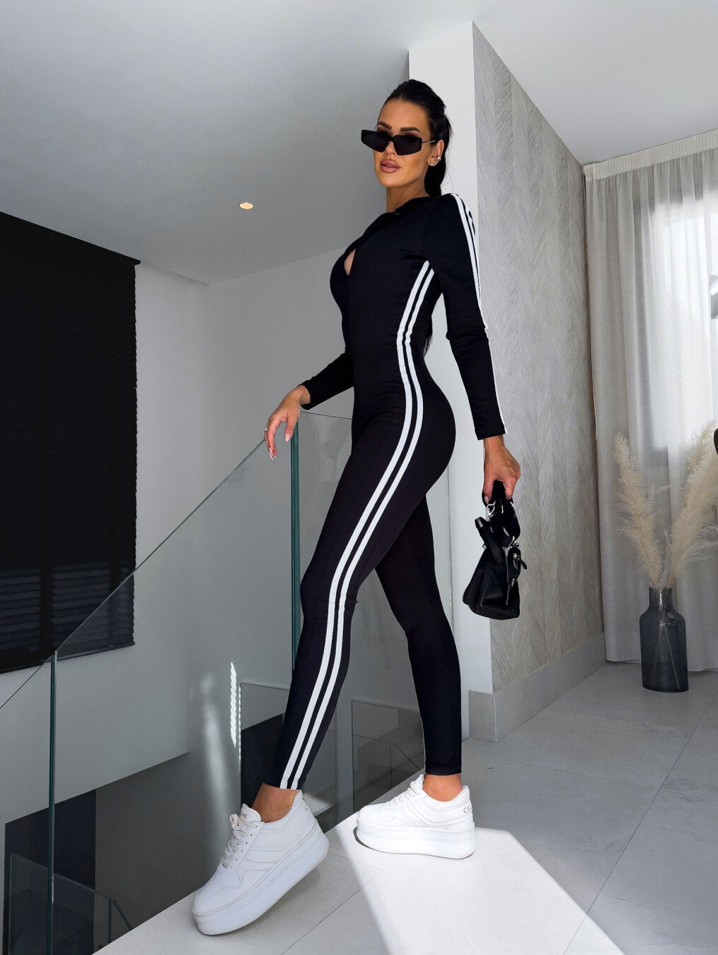 Mune | Dynamischer Jumpsuit mit Streifen
