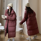 Damen Lange Pufferjacke mit Kapuze und voluminösem Schnitt EB