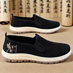 Herren nan nahtloser Canvas-Slip-On mit elastischem Einstieg, besticktem Fersenmotiv und rutschfester EVA-Laufsohle EB