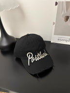 Baseballcap aus Distressed-Denim mit gesticktem Text