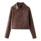 Women's short-cut faux leather jacket with zipper, pointed collar, and zippered pockets Mune Fashion