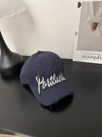 Baseballcap aus Distressed-Denim mit gesticktem Text