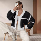 Damen Grobstrickjacke mit voluminösen Ärmeln und modernem Karomuster EB