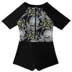 Damen Sporteinteiler mit floralem Design und kurzem Arm EB