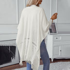 Damen eleganter Strickponcho mit fransigen Details und markantem Muster EB
