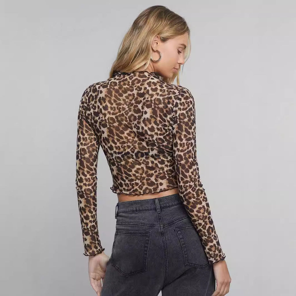 Damen nan figurbetontes bauchfreies Langarmshirt im Animalprint aus feinem Stretchnetz mit Stehkragen und Wellensaum EB