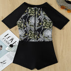 Damen Sporteinteiler mit floralem Design und kurzem Arm EB