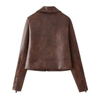 Women's short-cut faux leather jacket with zipper, pointed collar, and zippered pockets Mune Fashion