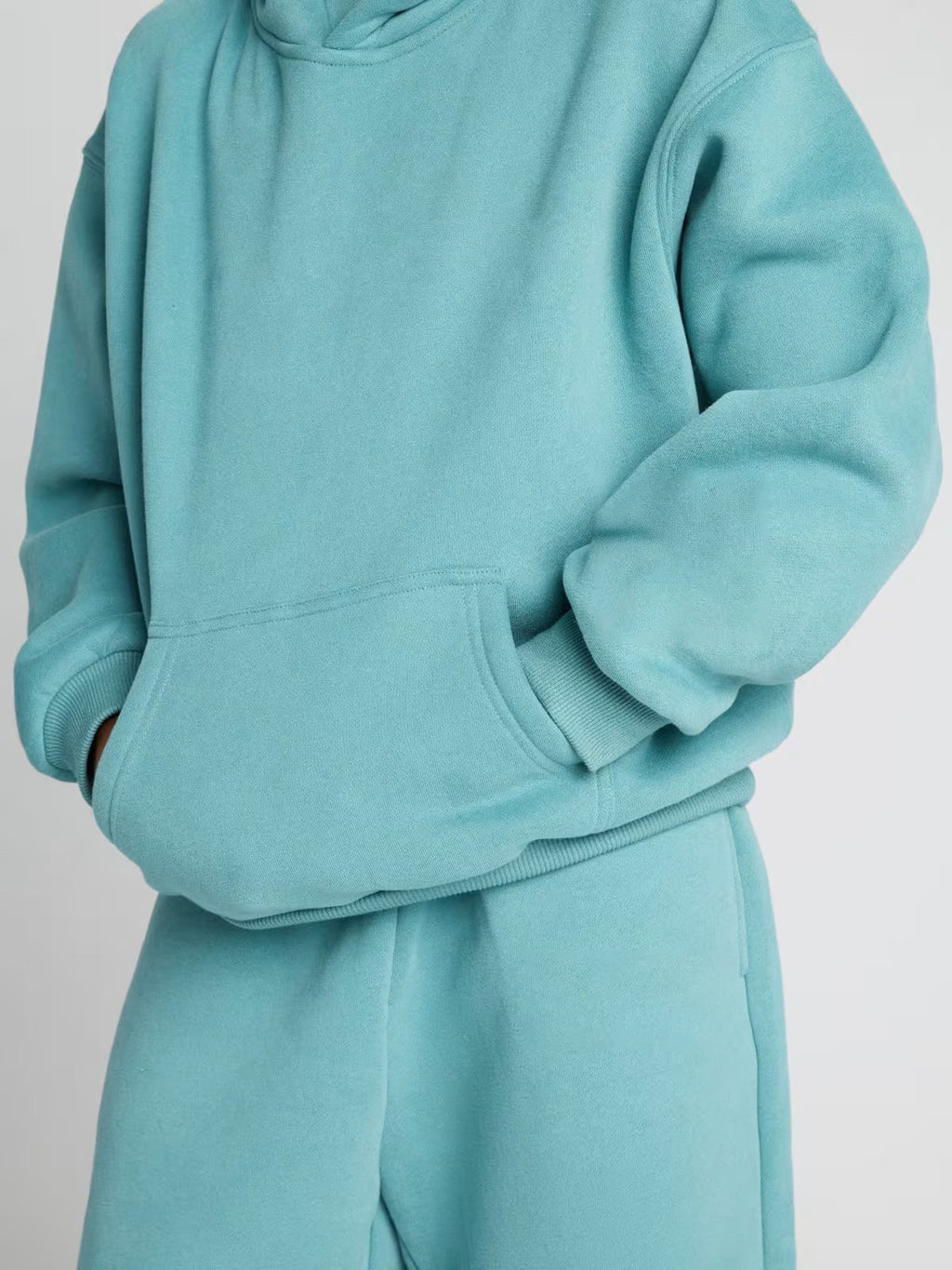 Damen lässiger Fleece-Jumpsuit mit geräumiger Kapuze und praktischen Taschen EB
