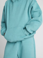 Damen lässiger Fleece-Jumpsuit mit geräumiger Kapuze und praktischen Taschen EB