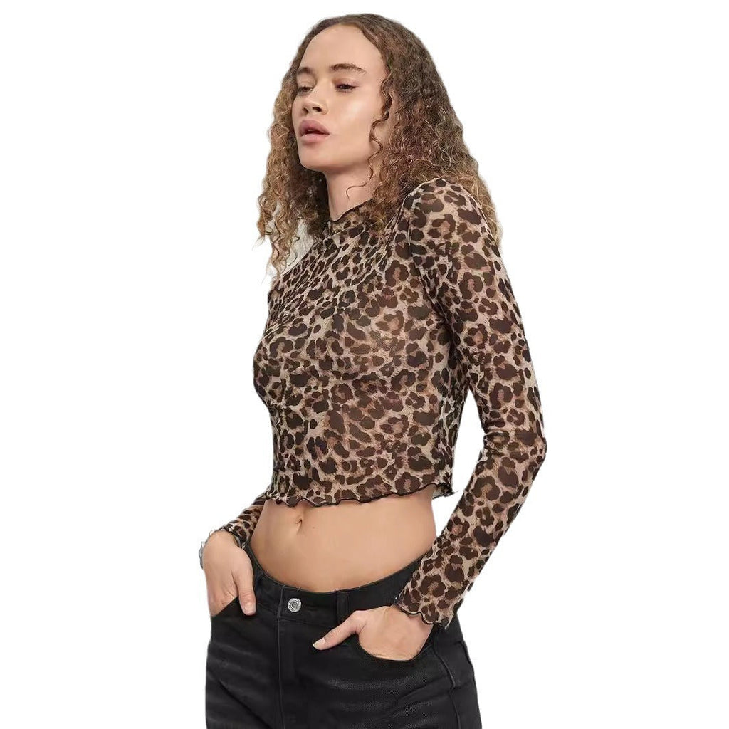 Damen nan figurbetontes bauchfreies Langarmshirt im Animalprint aus feinem Stretchnetz mit Stehkragen und Wellensaum EB