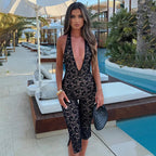 Damen Eleganter Spitzen-Jumpsuit mit tiefem V-Ausschnitt und figurbetonter Silhouette EB