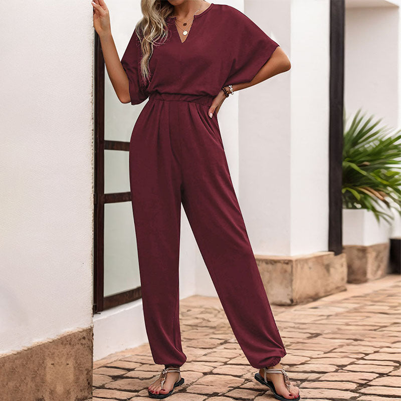 Lässiger Damen-Jumpsuit mit Taillensmock, kurzen Fledermausärmeln und elastischen Beinabschlüssen