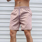 Atmungsaktive, einfarbige Badeshorts für Herren mit Kordelzug